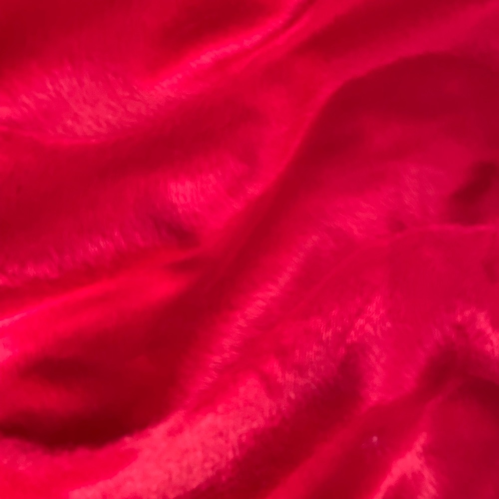 RED FABRIC SOFT FURRY FABRIC - Red soft light furry fabric.